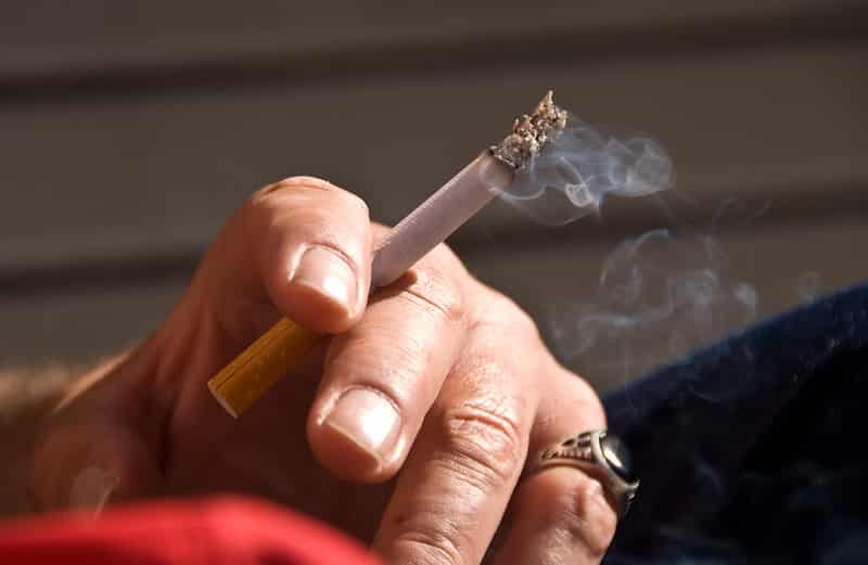 hand holding a cigarette