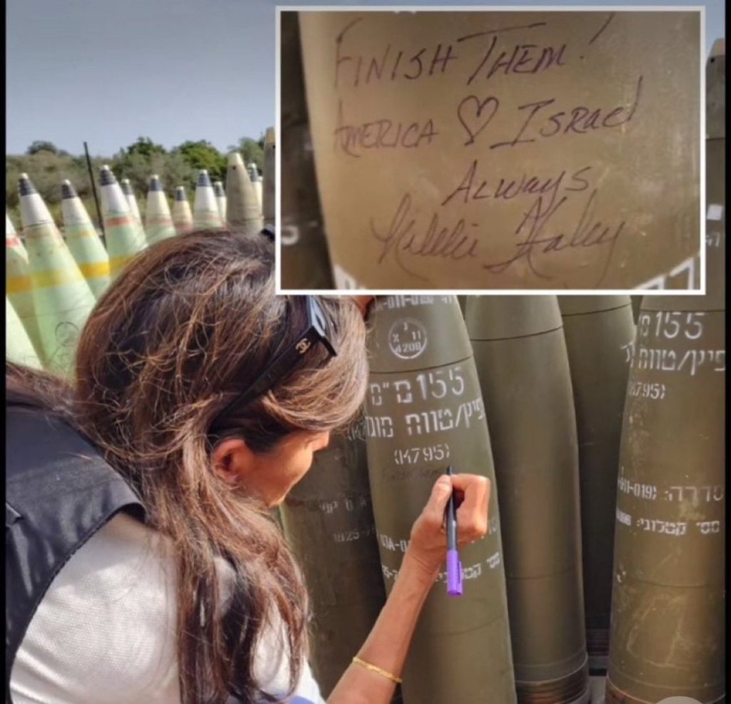 Nicky Haley writes “finish them” on an Israel missile.