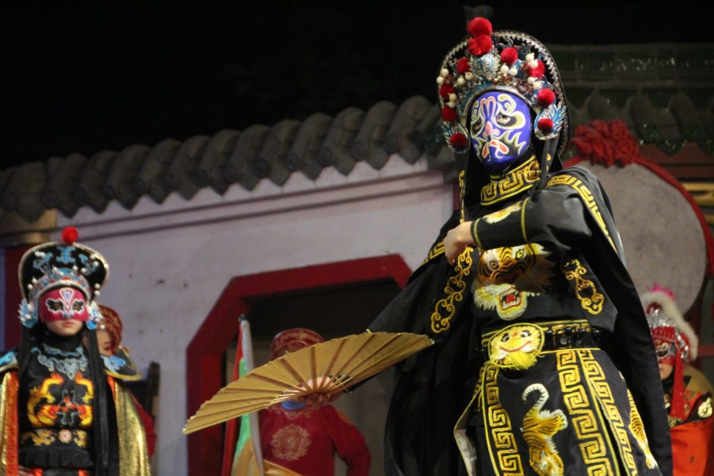 Chinese man wearing a blue mask.