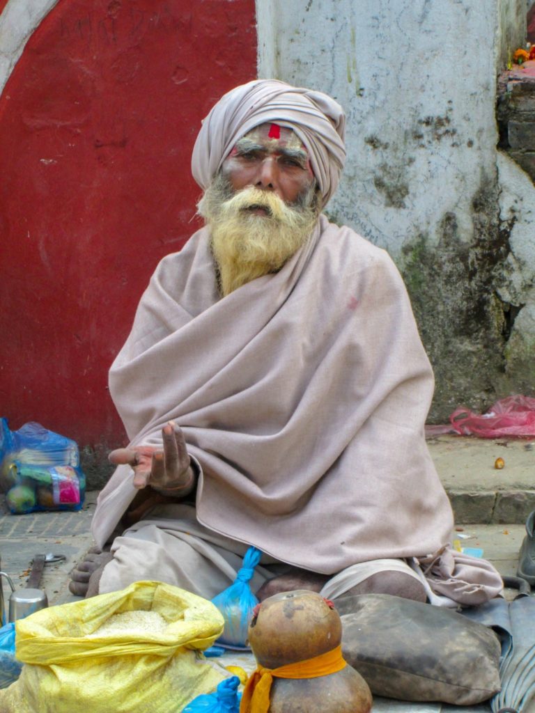 This is a photo of a man in Kathmandu begging for money.