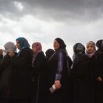 women in a line UNHCR in Lebanon