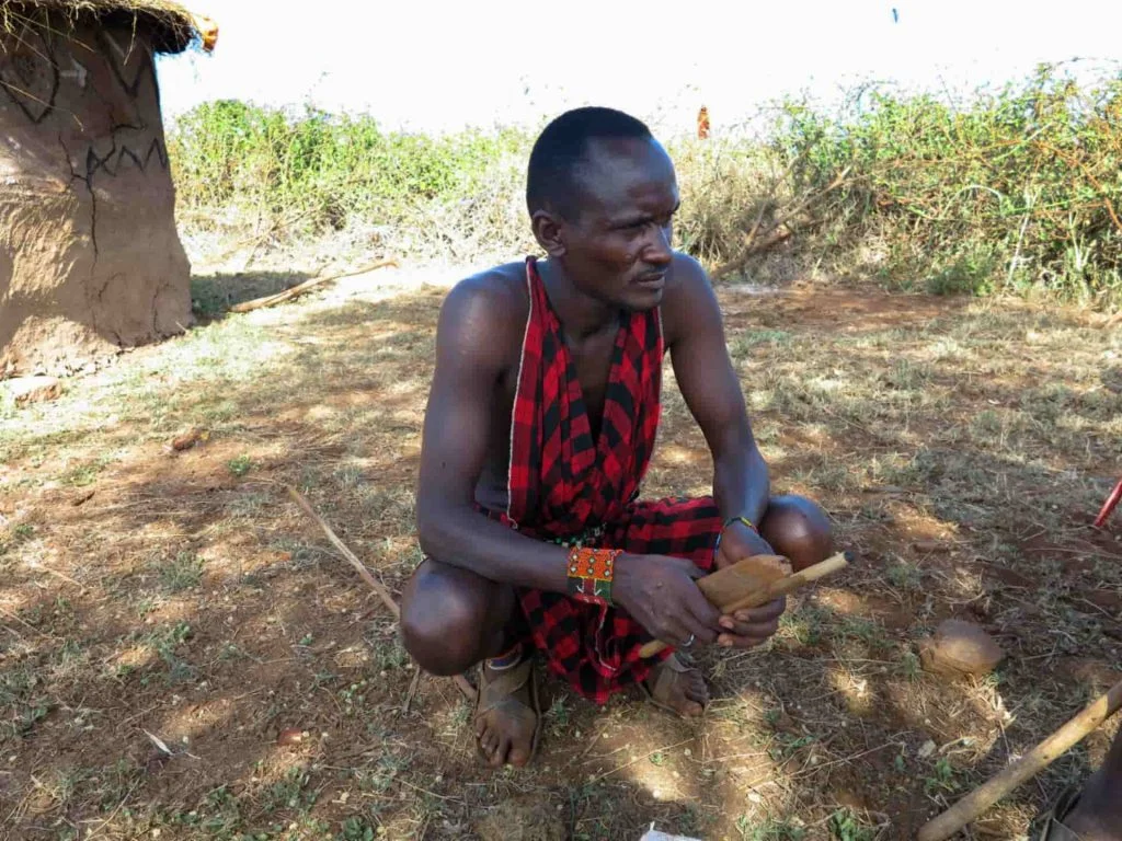Portraits from Tanzania - In Pictures 10 Maasai man lighting a fire 7774