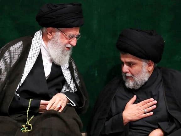 Muqtada al-Sadr sitting with Khamenei.