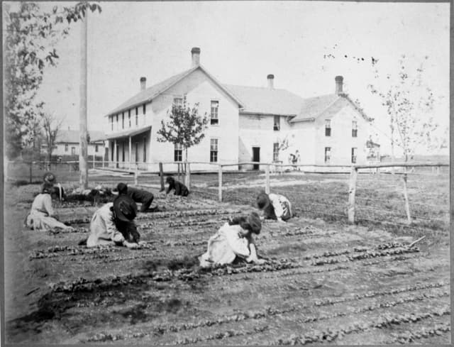 Native American children gardening in 1890s