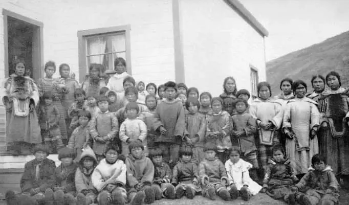 USA vs Canada: A history of residential schools in North America 4 Pangnirtung Natives at Mission House in 1927