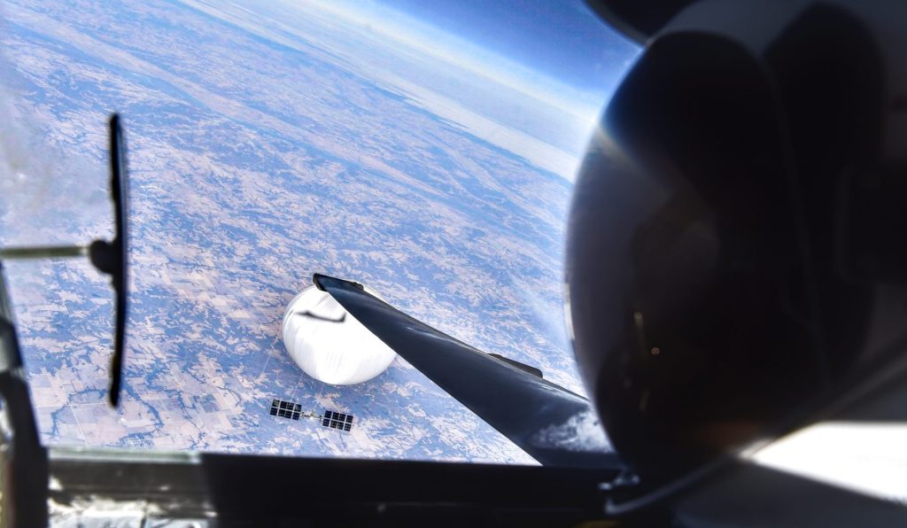 Pilot takes a selfie with Chinese balloon in the background.