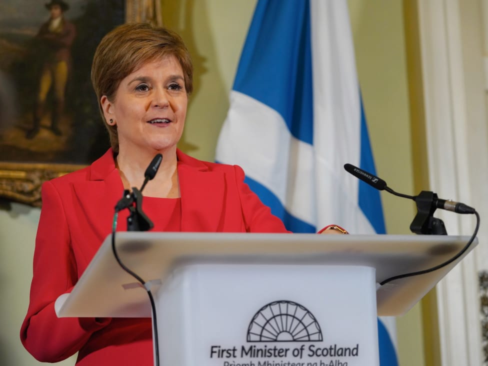 Nicola Sturgeon standing at a podium