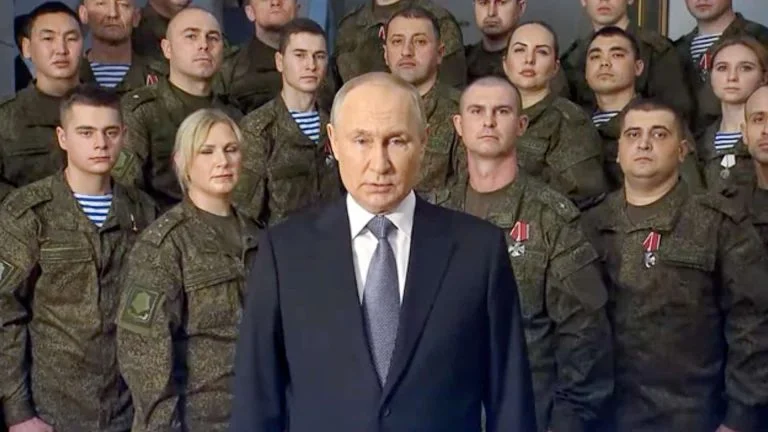 Putin standing in front of Russian troops.