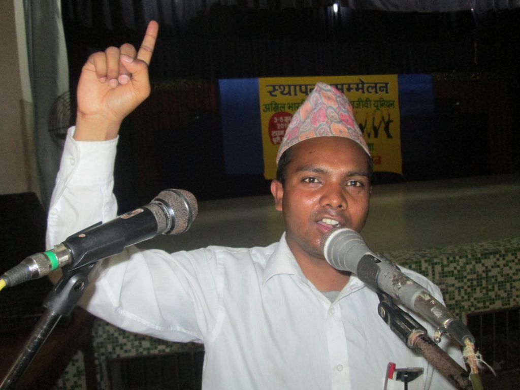 Sunil Kumar Pariyar speaking at an event. 