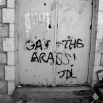 Gas the Arabs painted on the gate outside a Palestinian home in Hebron by Israeli settlers. It is signed JDL (Jewish Defence League). Photo: Magne Hagesæter © CC BY 3.0